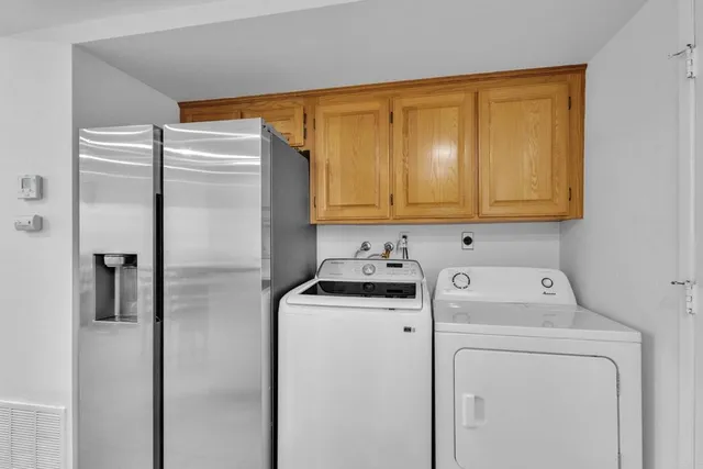 a white toilet sitting next to a bathroom sink