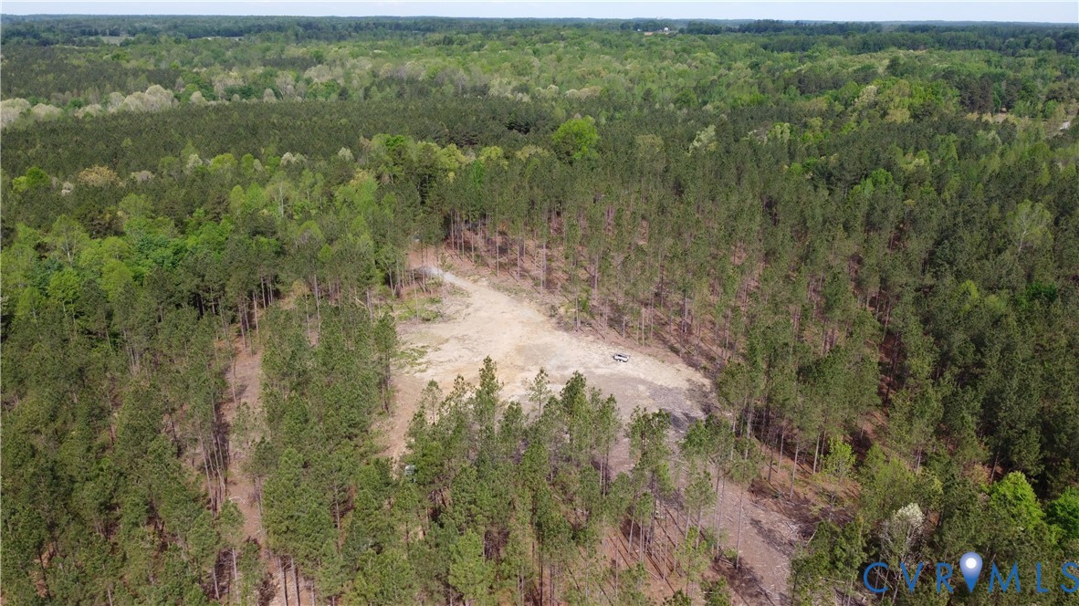 The property features extensive wooded areas with