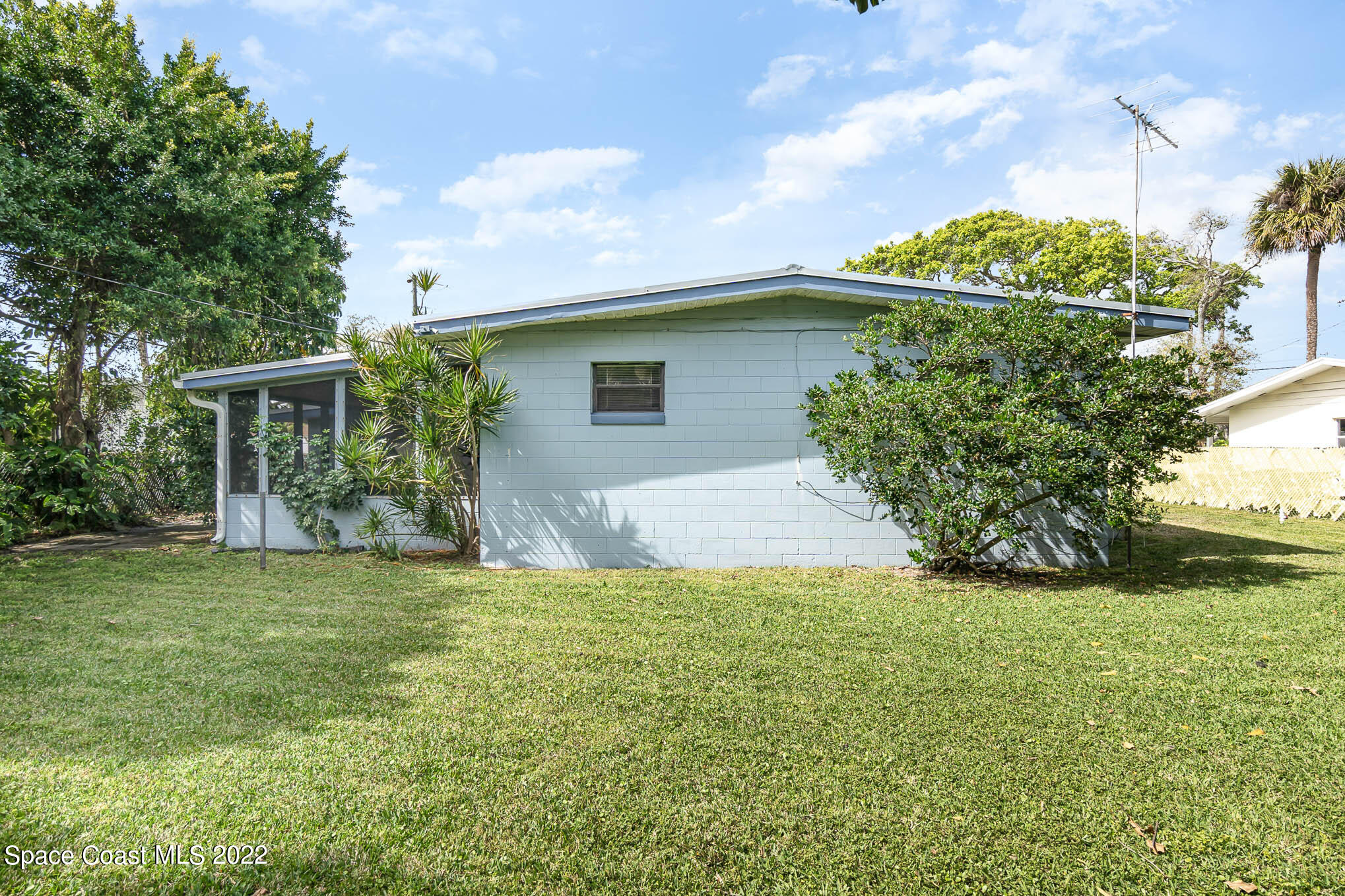 1024 Samar Road Cocoa Beach, FL 32931 - Photo 4 of 22 a view of a house with a yard