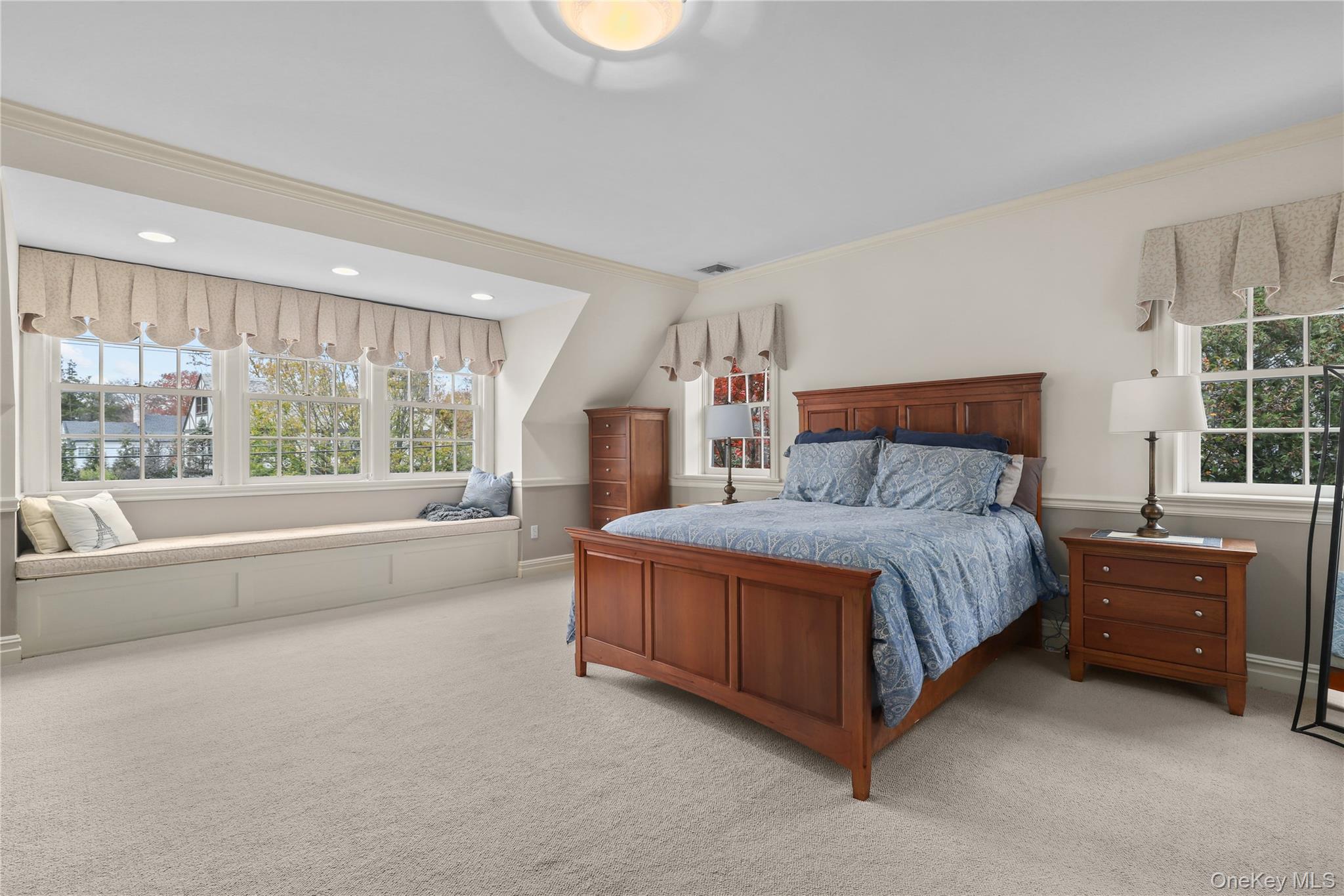12 Sunnybrae Place Bronxville, NY 10708 - Photo 15 of 40 Primary Bedroom with crown molding and carpet floors