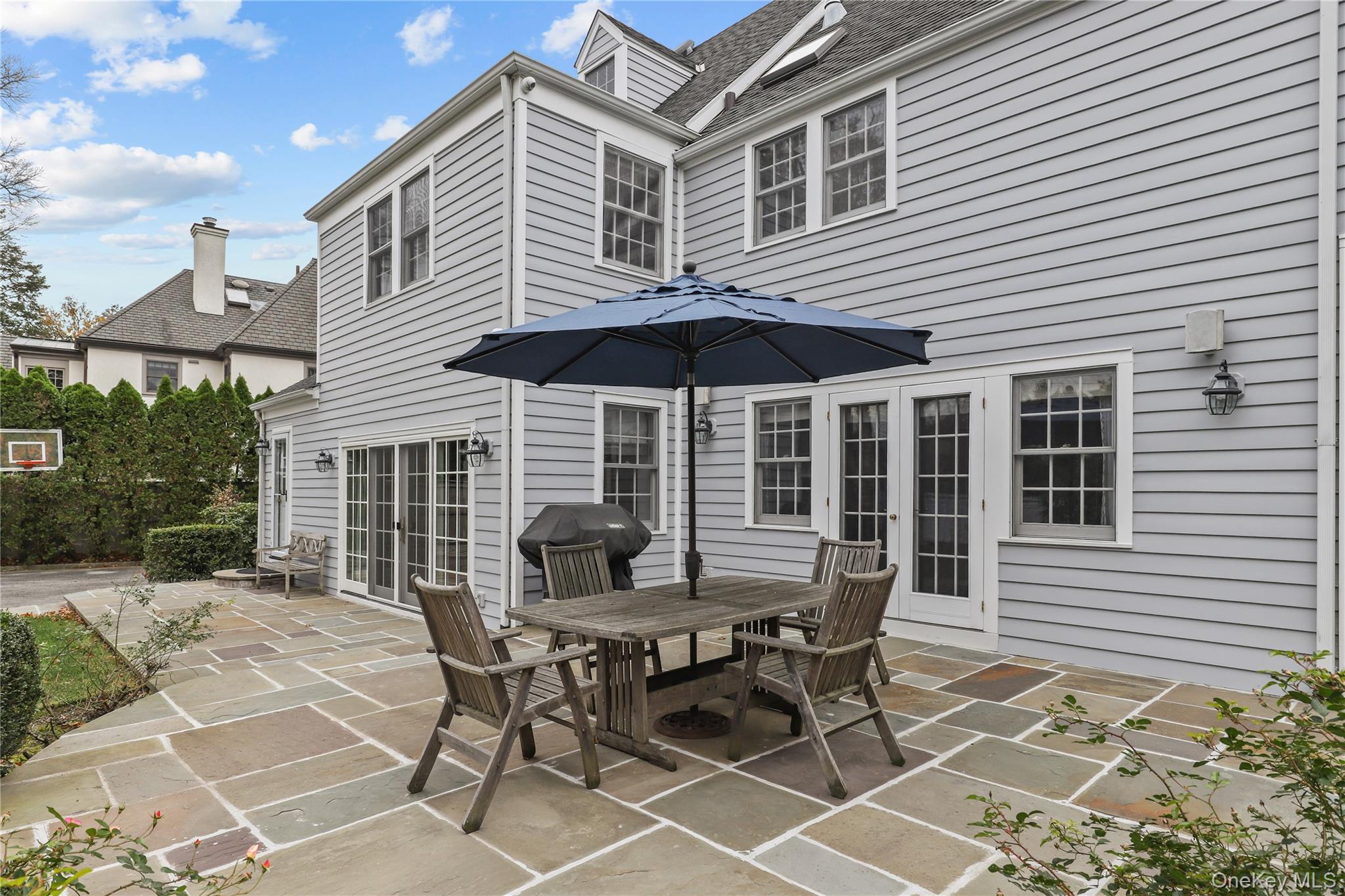 12 Sunnybrae Place Bronxville, NY 10708 - Photo 34 of 40 View of patio with a grill, outdoor dining area, and french doors