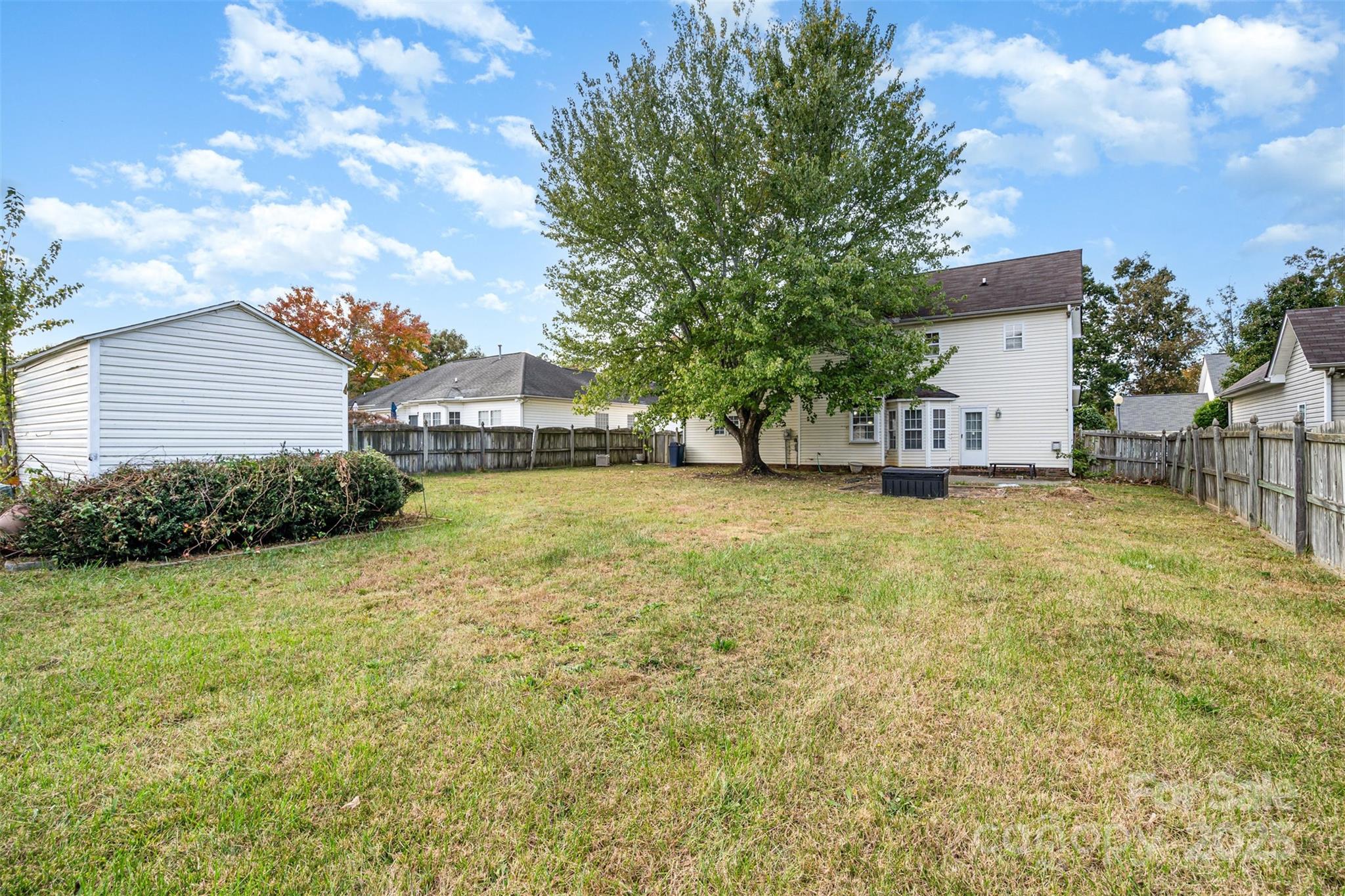 2218 Tree Ridge Road Indian Trail, NC 28079 - Photo 20 of 23 a view of a house with a yard and sitting area