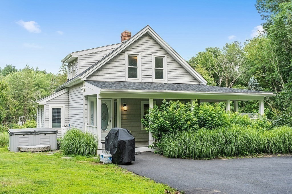 203 Stow Road Harvard, MA 01451 - Photo 42 of 42 a front view of a house with a yard