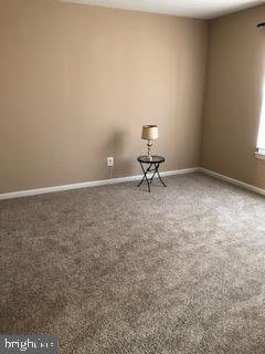 a view of an empty room and a window