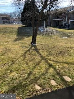 a swimming pool with outdoor seating and yard