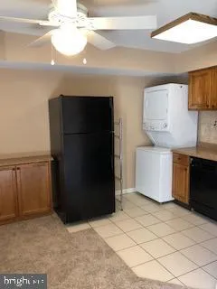 a kitchen with a refrigerator and a stove
