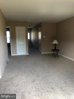 a view of a livingroom with a bench