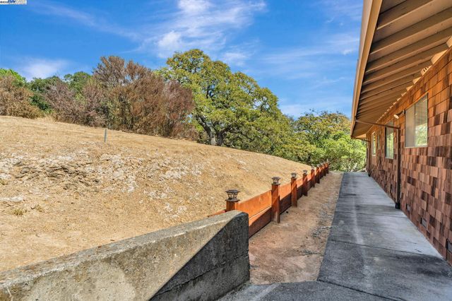 an aerial view of a house with mountain view