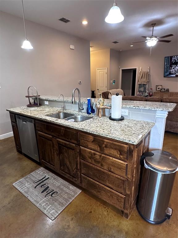 1212 Bowman Ridge Road Stephenville, TX 76401 - Photo 9 of 23 a kitchen with a stove and a sink