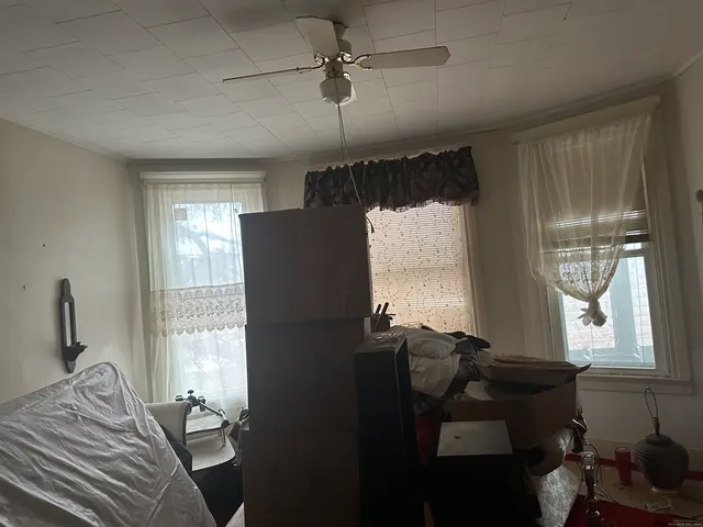 a bedroom with furniture and windows