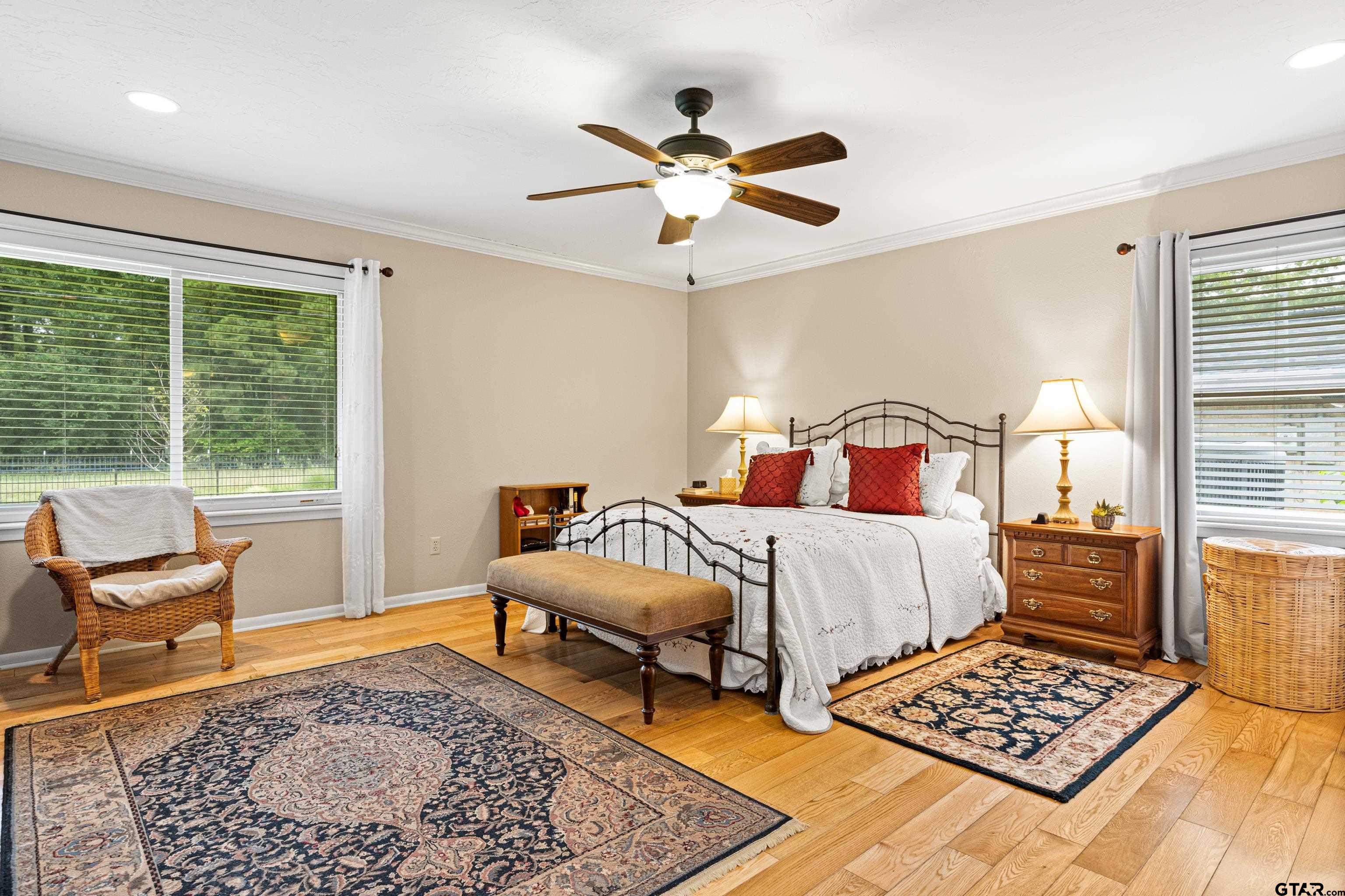 1610 Pinecrest Street Gilmer, TX 75644 - Photo 16 of 40 a bedroom with a bed and window