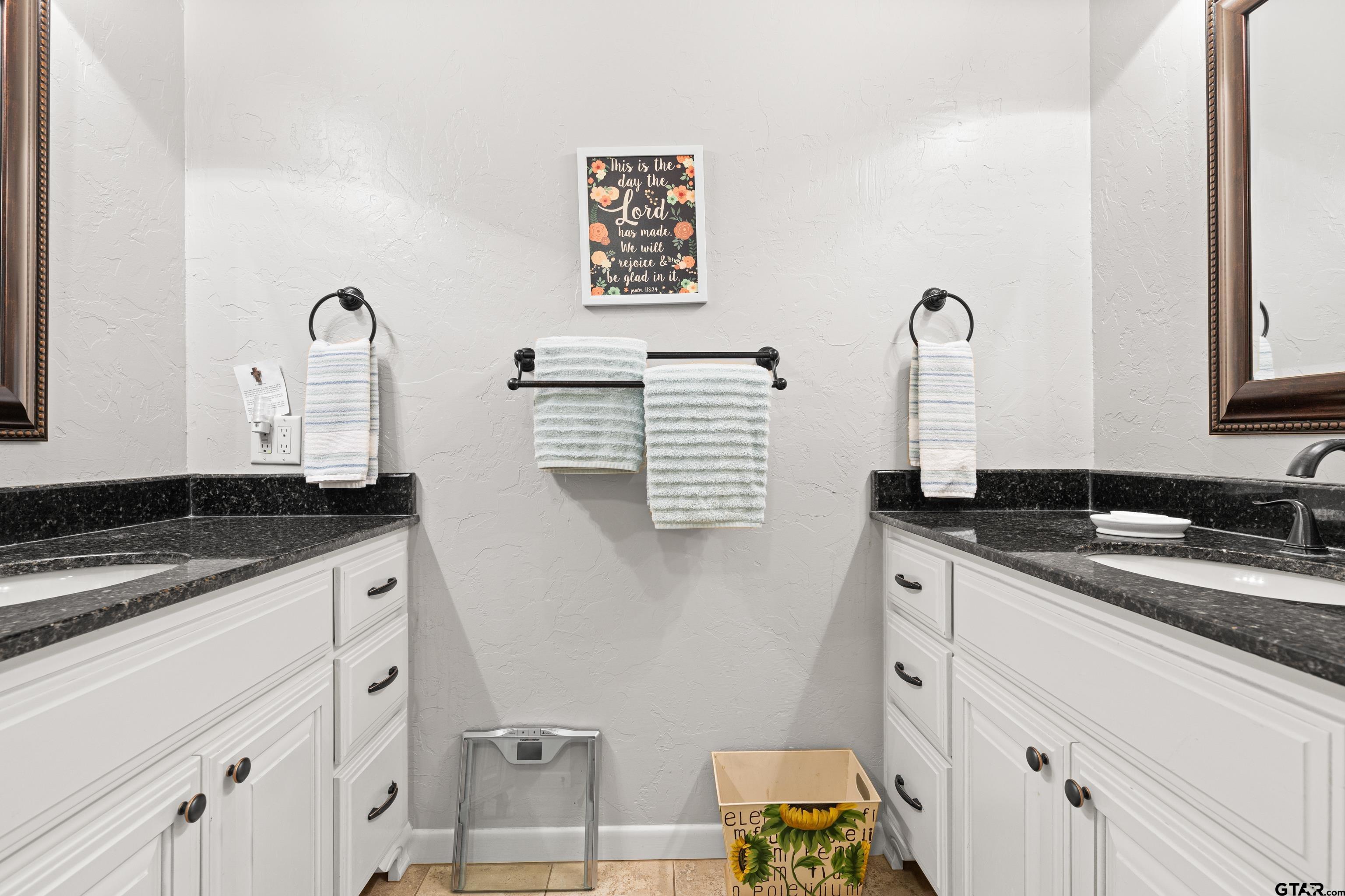 1610 Pinecrest Street Gilmer, TX 75644 - Photo 19 of 40 a kitchen with granite countertop a sink and a stove top oven