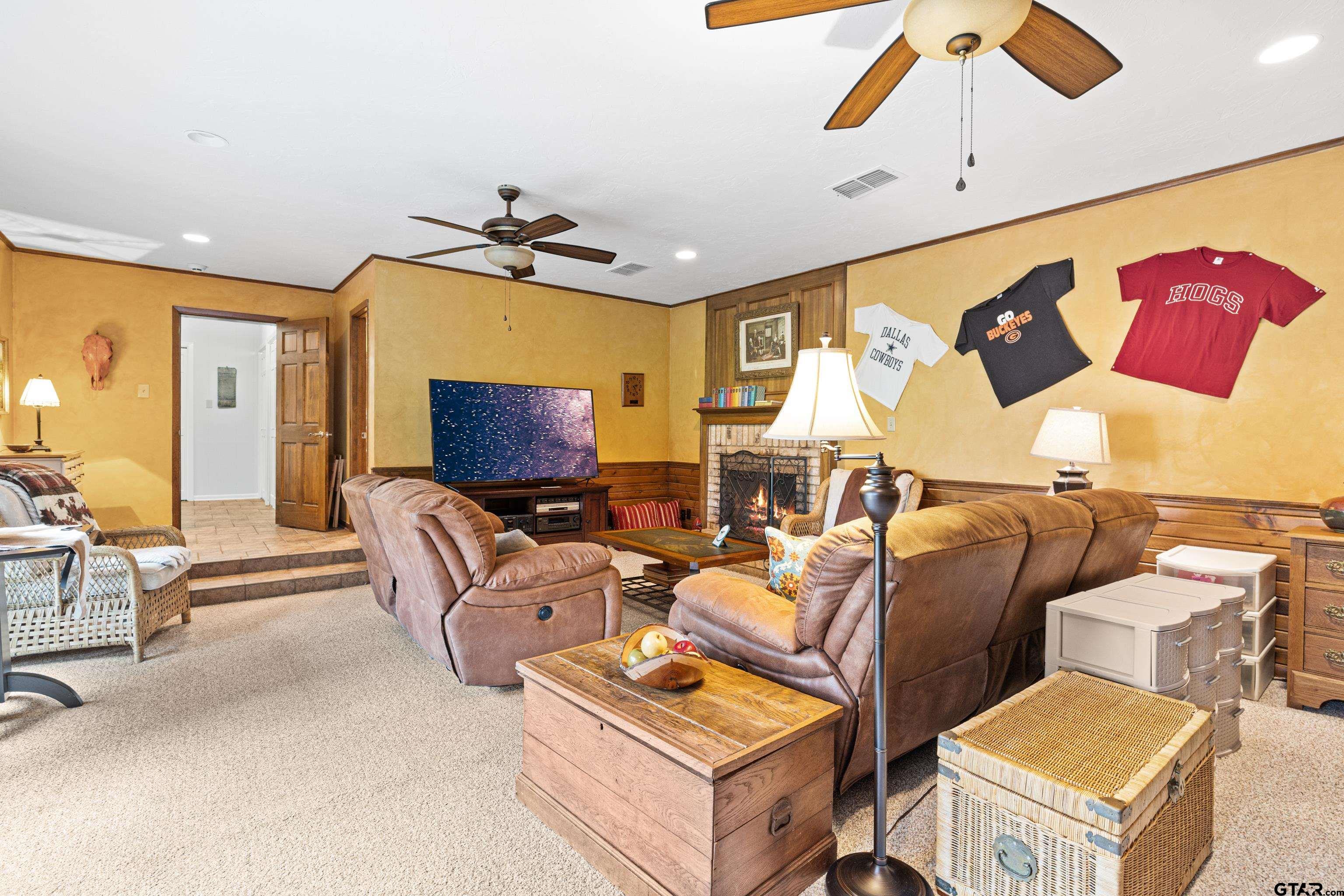 1610 Pinecrest Street Gilmer, TX 75644 - Photo 22 of 40 a living room with furniture and a flat screen tv
