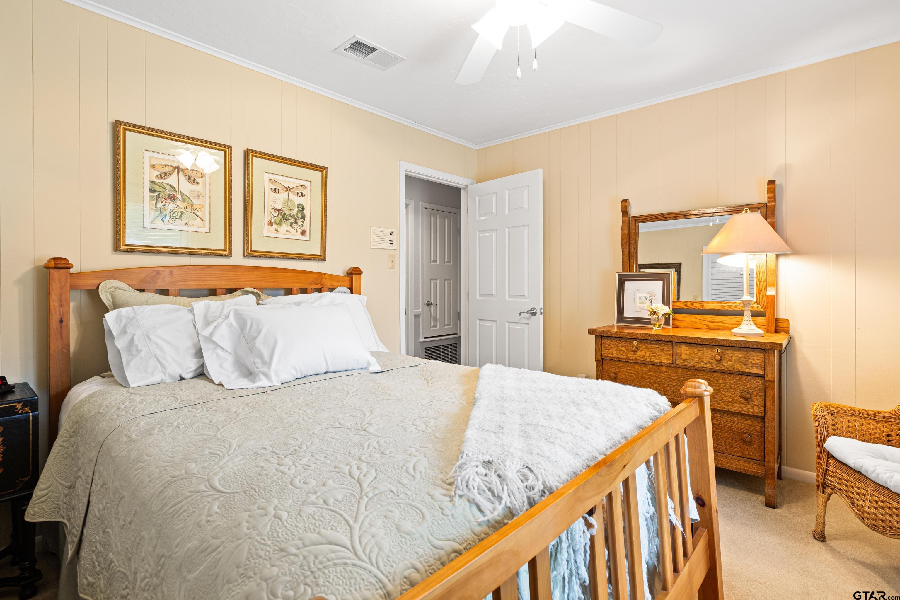 1610 Pinecrest Street Gilmer, TX 75644 - Photo 27 of 40 a bedroom with a bed and a view of bathroom