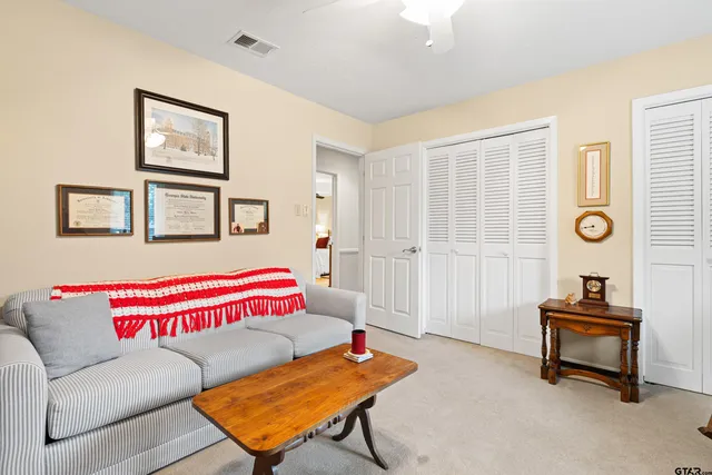a view of a house with backyard porch and sitting area