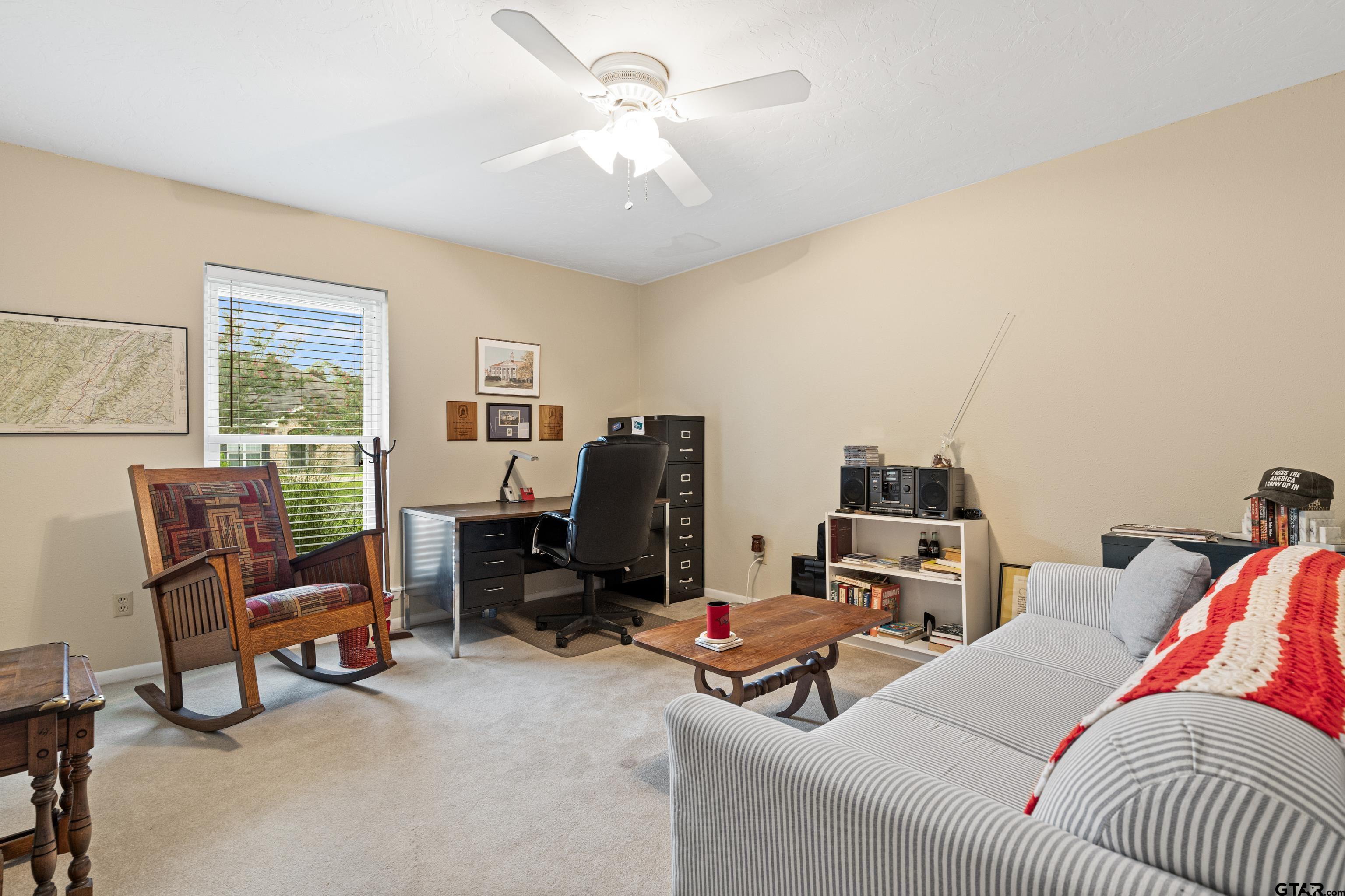 1610 Pinecrest Street Gilmer, TX 75644 - Photo 32 of 40 a view of a livingroom with workspace and a window