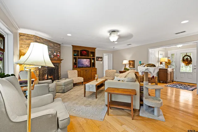 a living room with furniture piano and a table