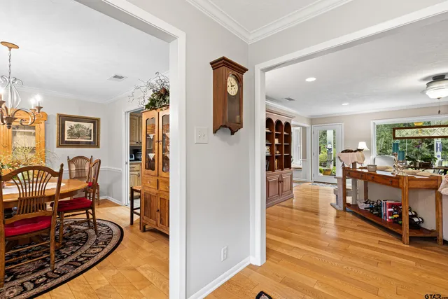 a view of a livingroom with furniture and hardwood floor