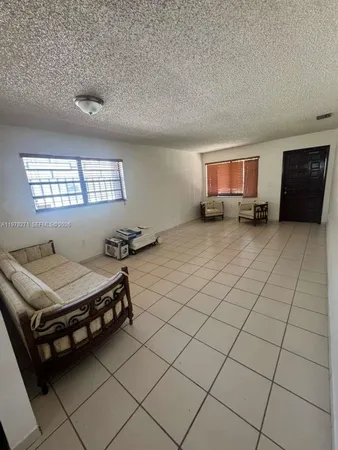 a room with furniture and window