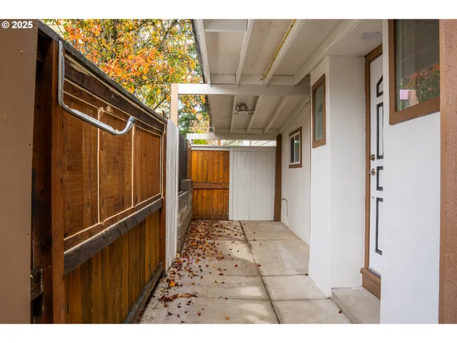 a view of a back yard with wooden floor