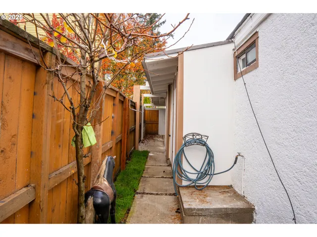 a view of a hallway with wooden door