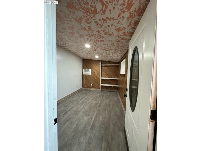 a view of a livingroom with wooden floor