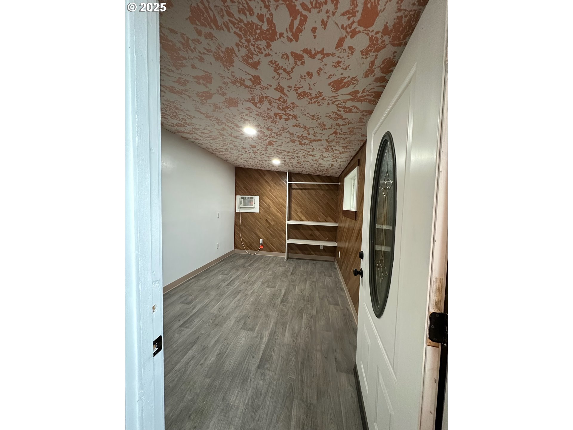 11803 Southeast Division Street, Unit 38 Portland, OR 97266 - Photo 18 of 24 a view of entryway with wooden floor