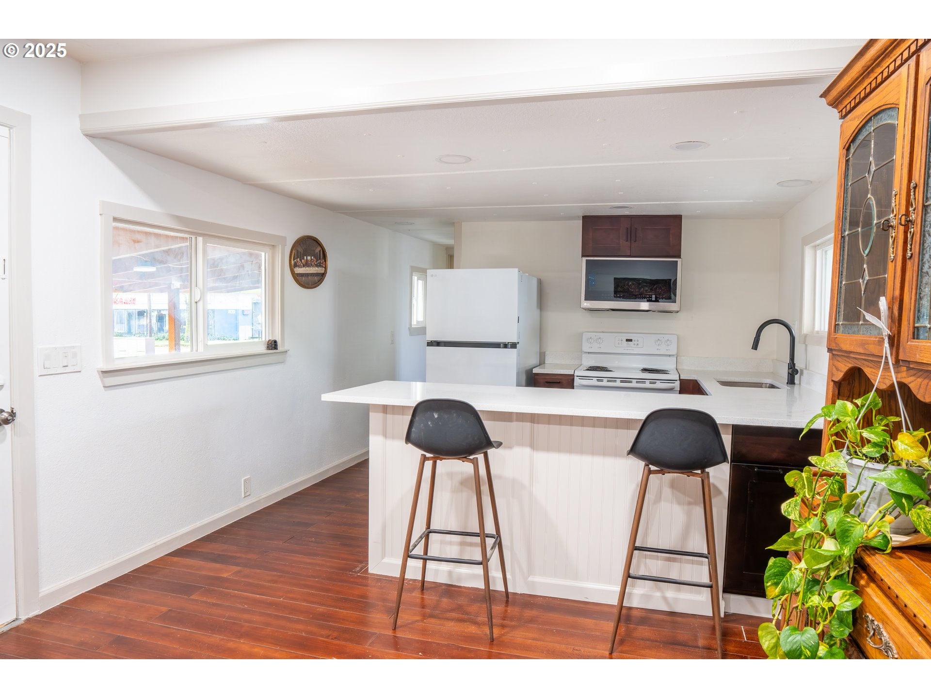 11803 Southeast Division Street, Unit 38 Portland, OR 97266 - Photo 2 of 24 a living room with a couch and a flat screen tv