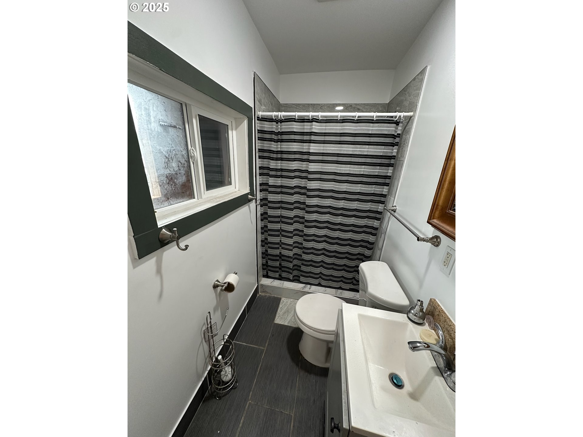 11803 Southeast Division Street, Unit 38 Portland, OR 97266 - Photo 21 of 24 a bathroom with a sink and toilet