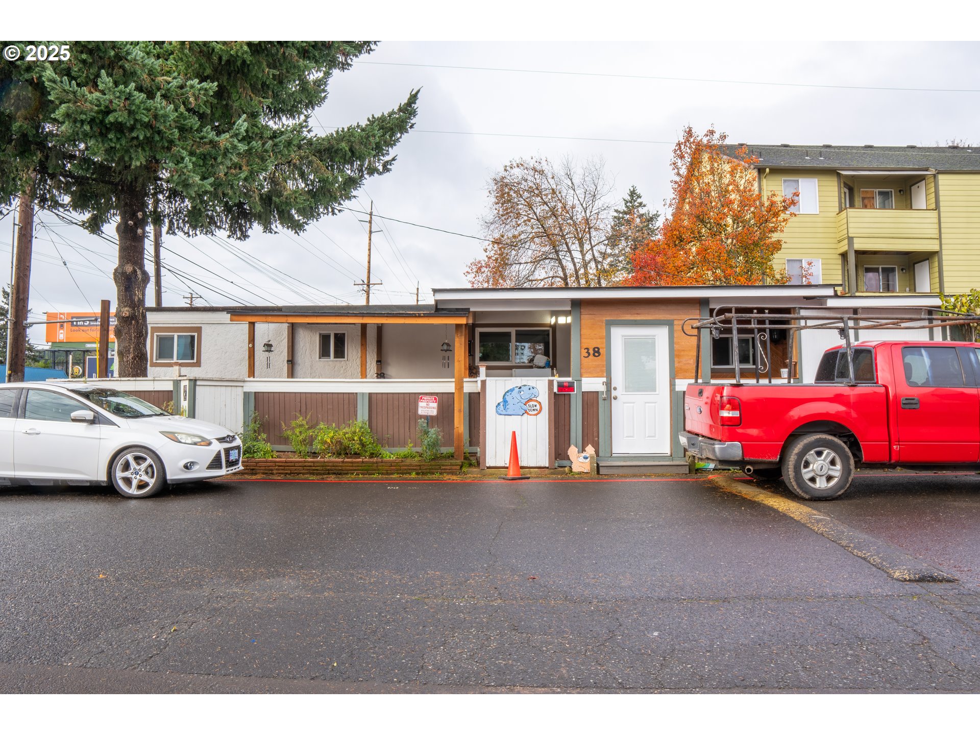 11803 Southeast Division Street, Unit 38 Portland, OR 97266 - Photo 24 of 24 a view of a car in front of a house