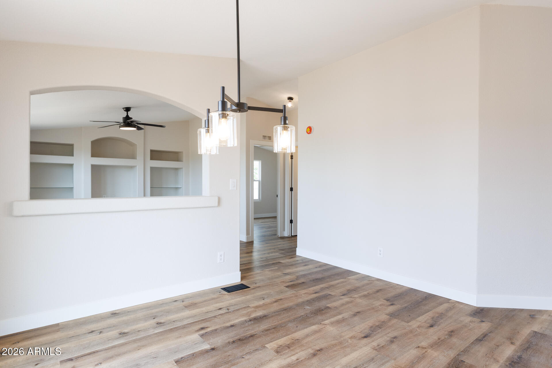 10290 North Katsina Road Casa Grande, AZ 85122 - Photo 11 of 51 a view of a hallway with wooden floor and a window