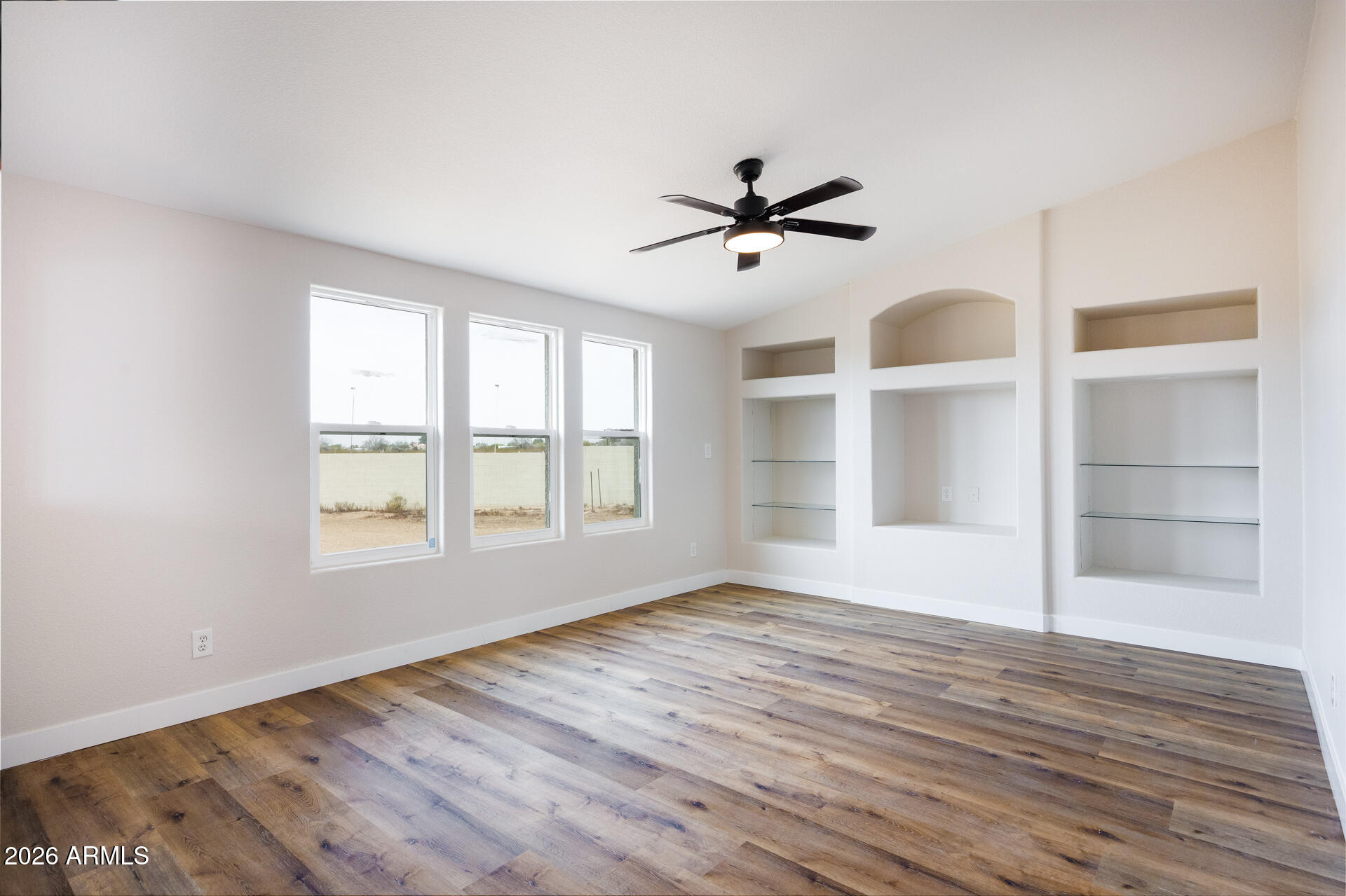 10290 North Katsina Road Casa Grande, AZ 85122 - Photo 17 of 51 a view of empty room with wooden floor and fan