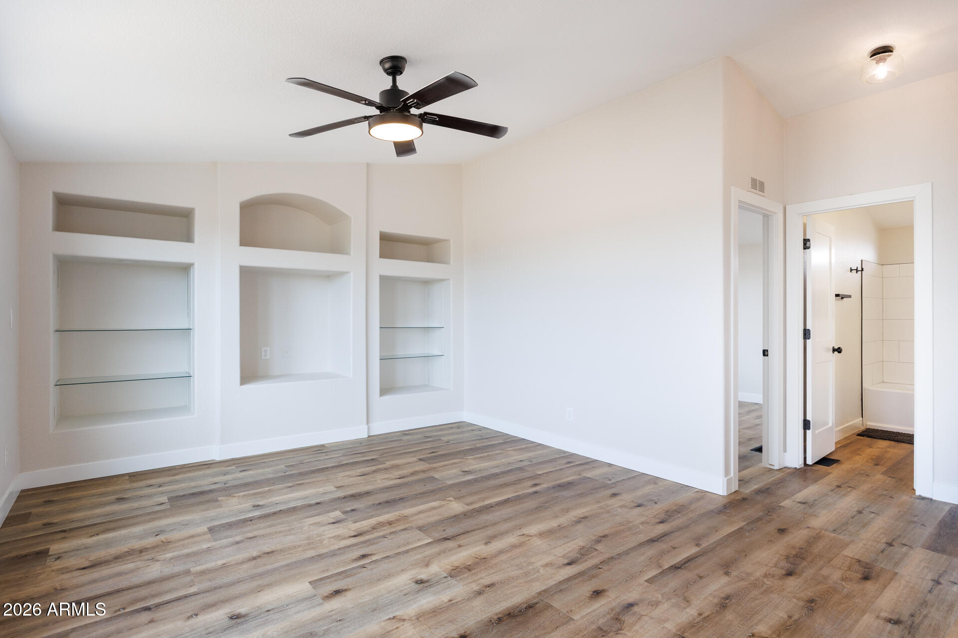 10290 North Katsina Road Casa Grande, AZ 85122 - Photo 19 of 51 a view of a livingroom with a hardwood floor and a ceiling fan