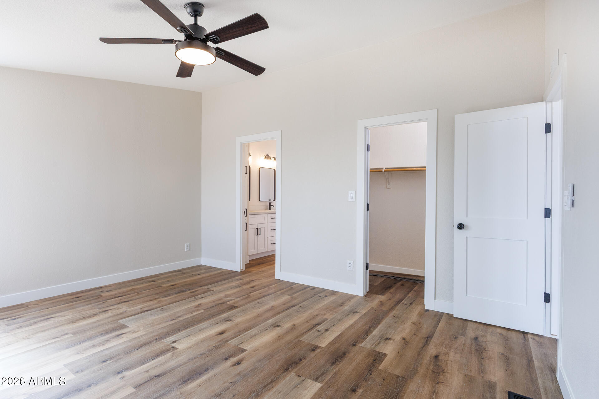 10290 North Katsina Road Casa Grande, AZ 85122 - Photo 23 of 51 an empty room with wooden floor closet and ceiling fan