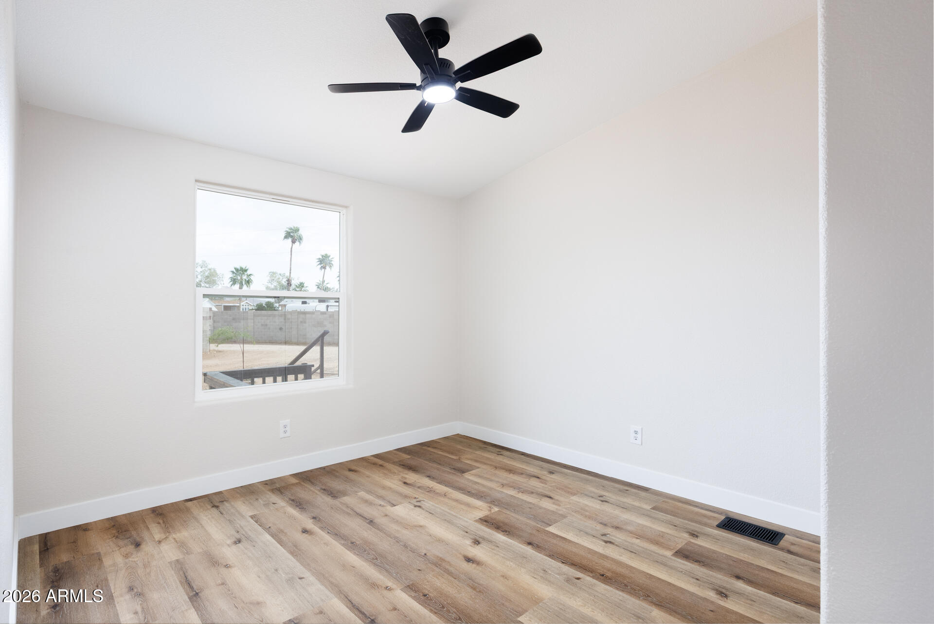 10290 North Katsina Road Casa Grande, AZ 85122 - Photo 28 of 51 an empty room with wooden floor and windows