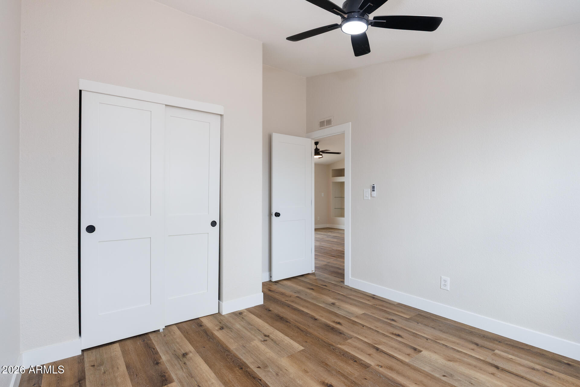 10290 North Katsina Road Casa Grande, AZ 85122 - Photo 29 of 51 a view of empty room with wooden floor