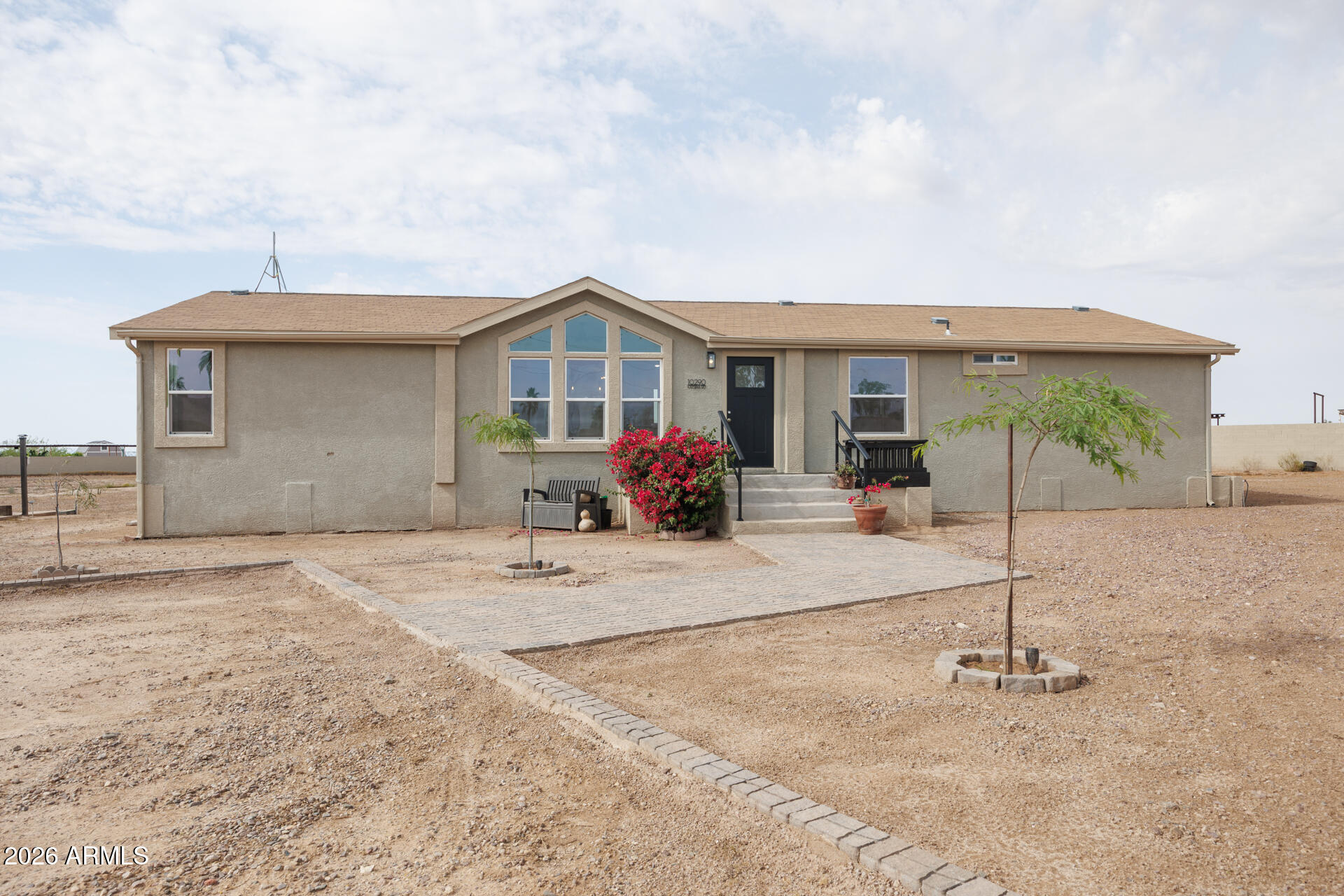 10290 North Katsina Road Casa Grande, AZ 85122 - Photo 3 of 51 a view of a house with a backyard and a garage