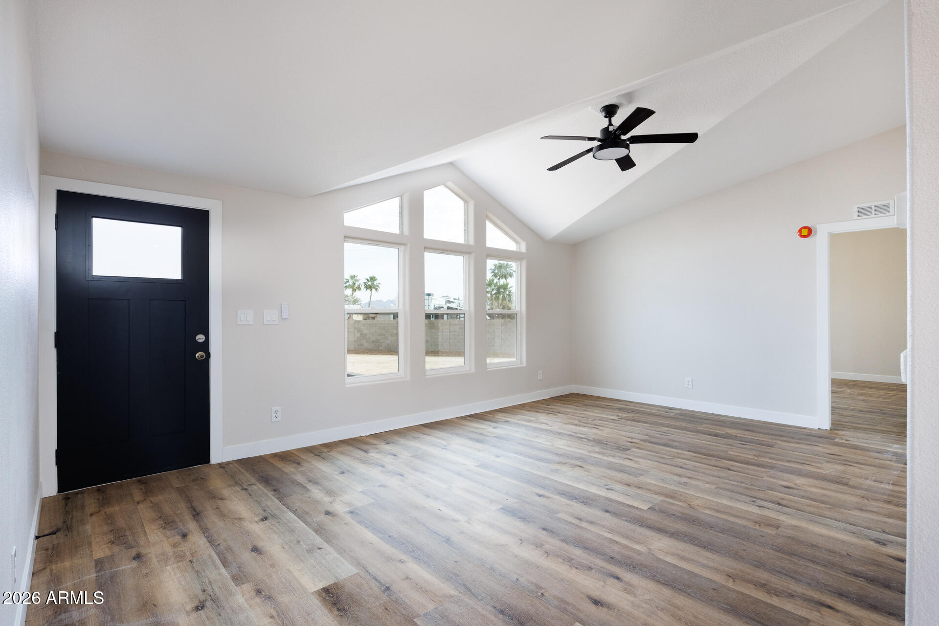 10290 North Katsina Road Casa Grande, AZ 85122 - Photo 6 of 51 a view of empty room with wooden floor and fan