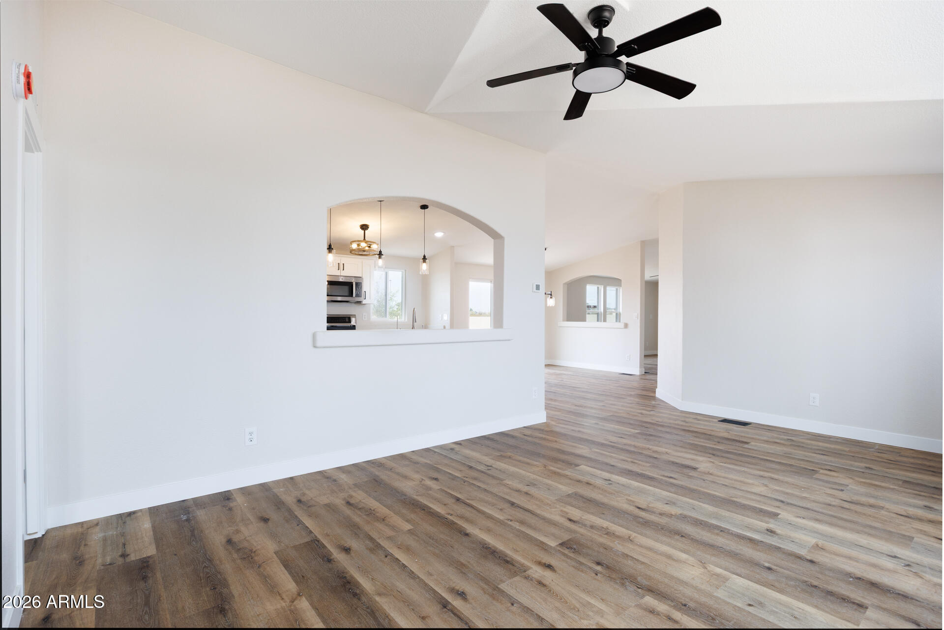 10290 North Katsina Road Casa Grande, AZ 85122 - Photo 9 of 51 a view of empty room with wooden floor and ceiling fan