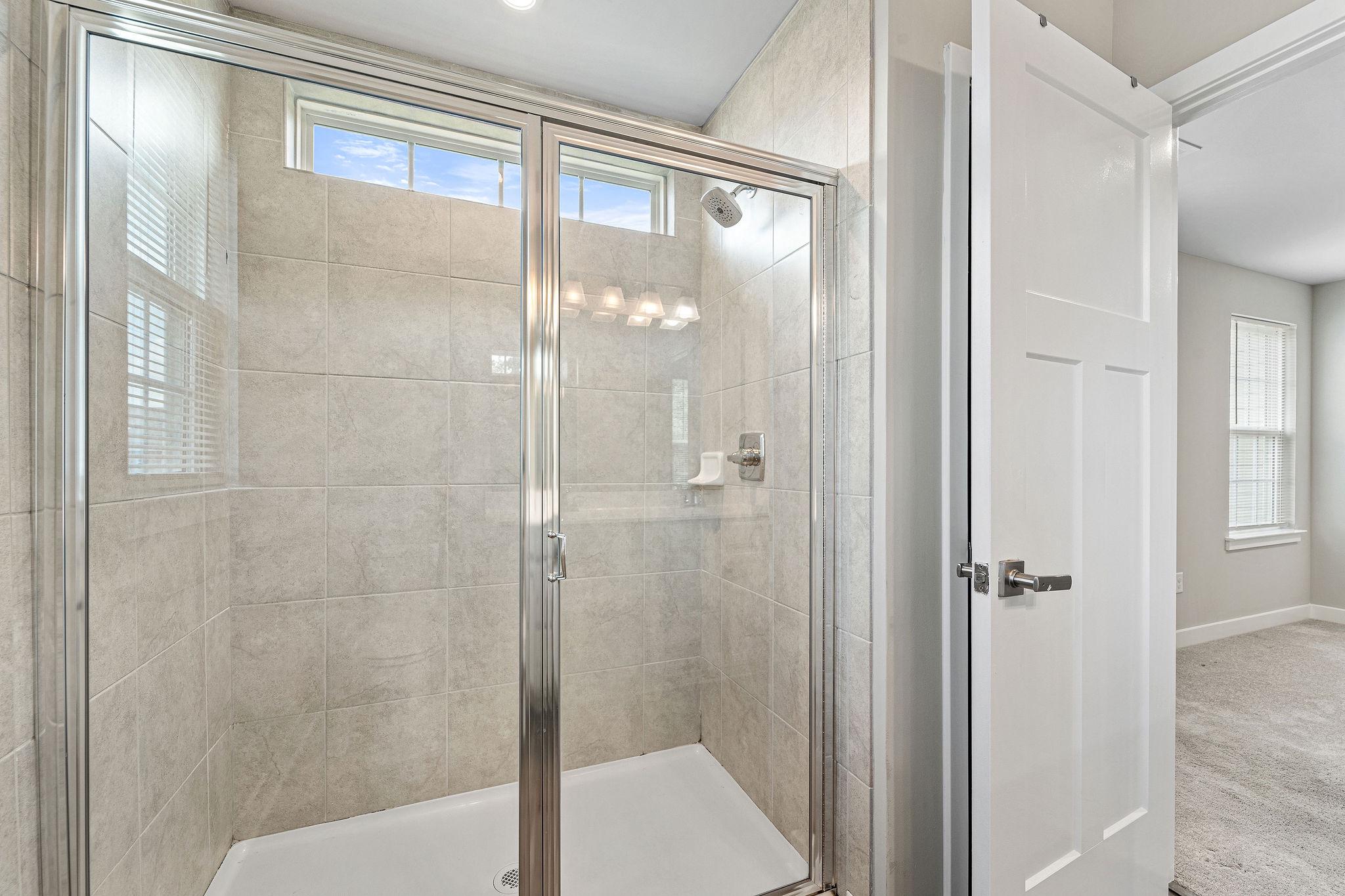 2 Sparrow Circle Sewell, NJ 08080 - Photo 14 of 24 Sleek modern shower in the primary bathroom.