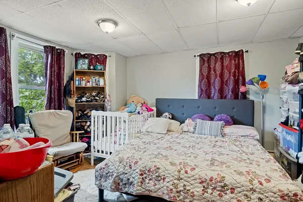 a bedroom with furniture and a bed