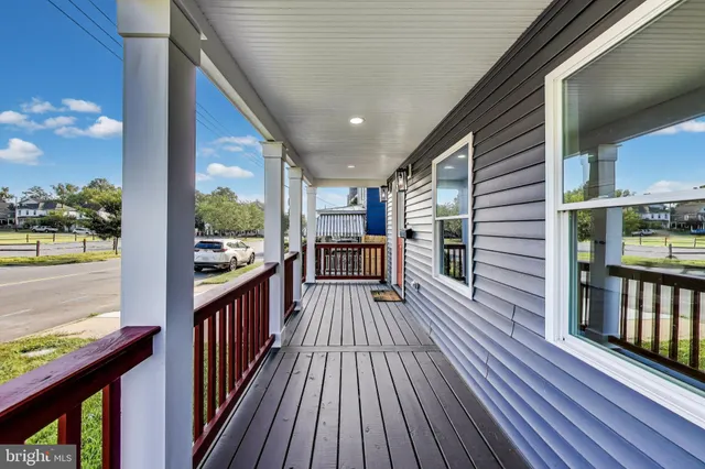 a view of a porch with wooden floor and outdoor space