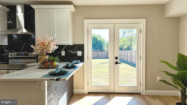 a bathroom with a toilet a sink and a mirror