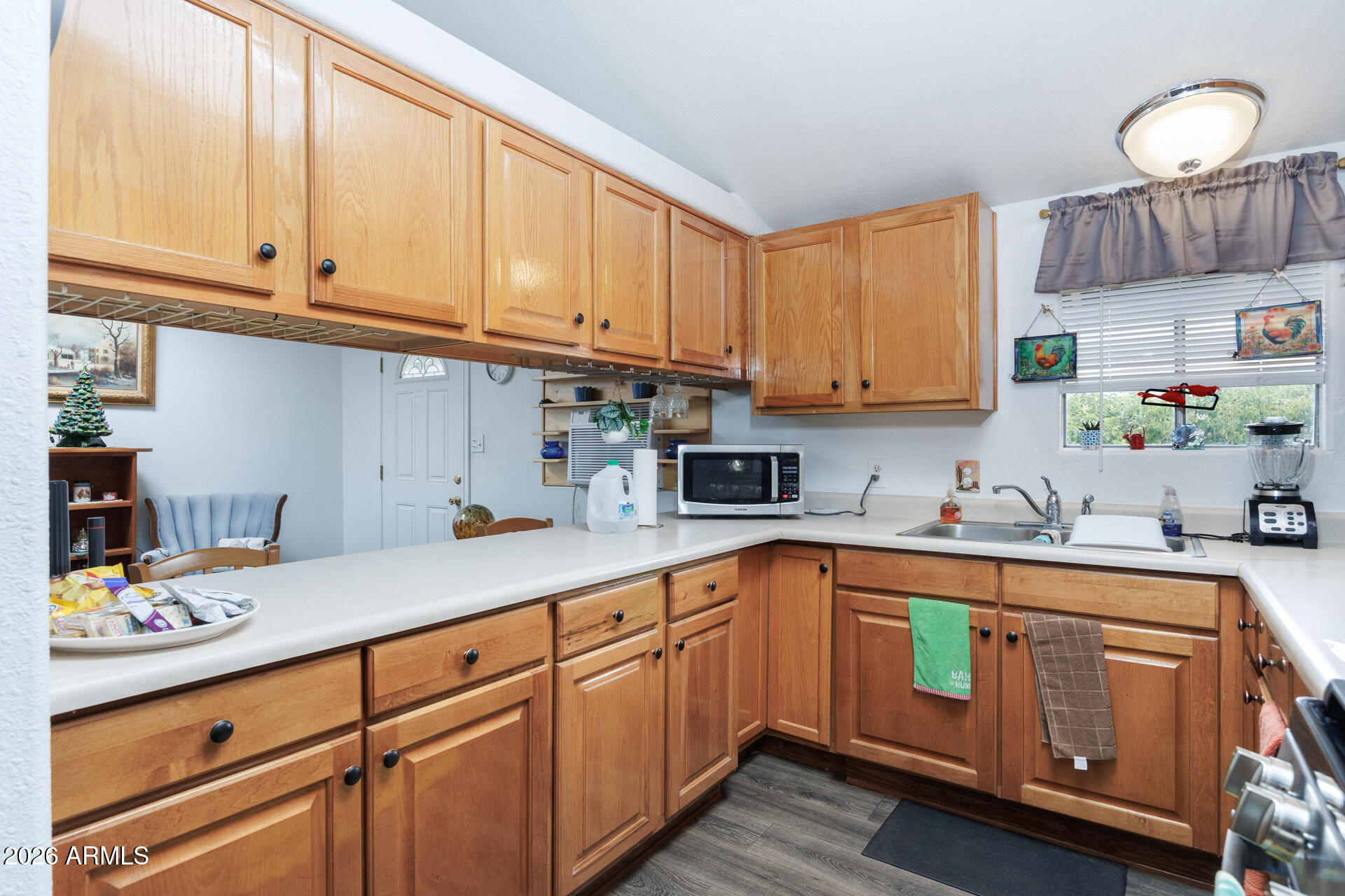 6185 East Monitor Street Picacho, AZ 85141 - Photo 46 of 55 a kitchen with kitchen island granite countertop a sink cabinets and stainless steel appliances