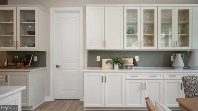 a bathroom with a double vanity sink a toilet a mirror and vanity
