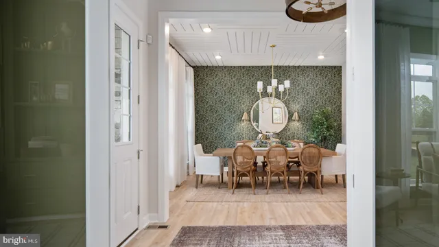 a dining room with furniture and wooden floor