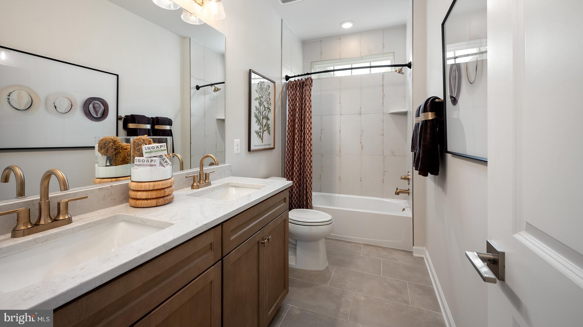 Tbb While Away Drive, Unit RICHMOND Bowie, MD 20716 - Photo 52 of 99 a bathroom with a granite countertop sink toilet and shower