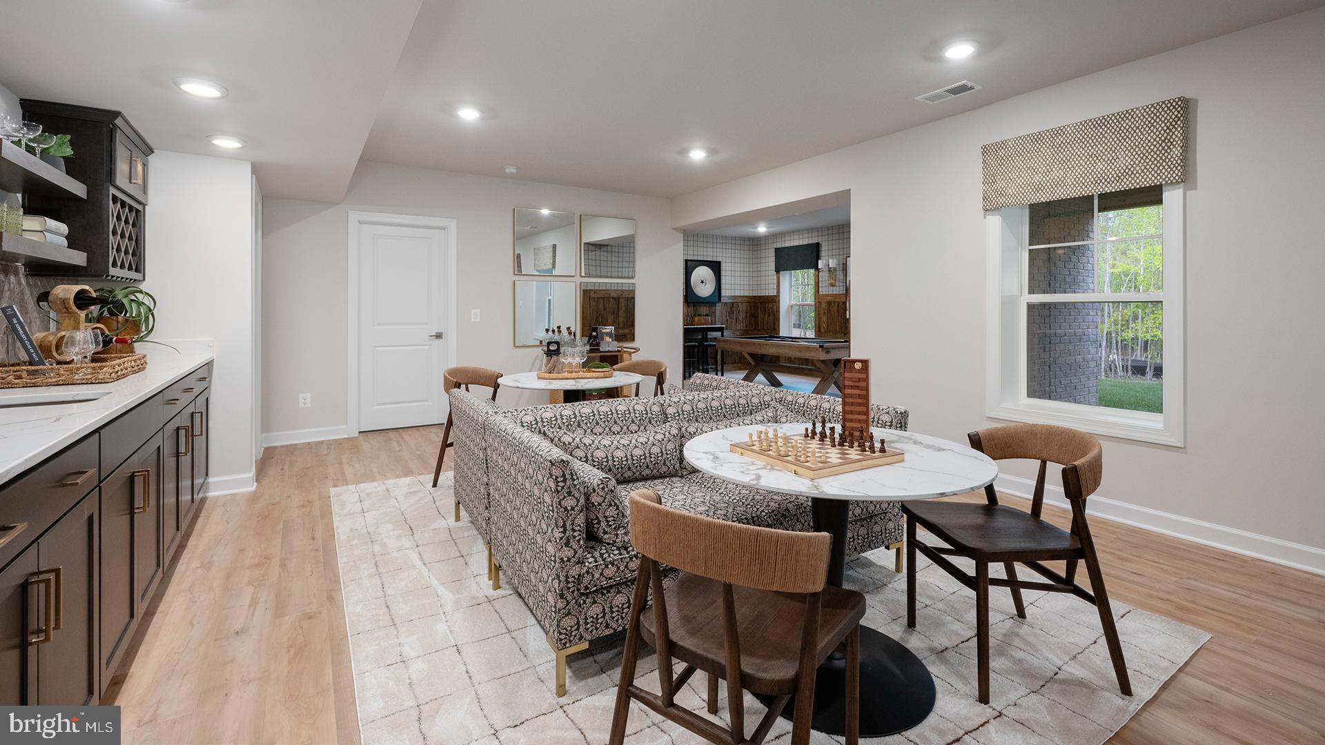 Tbb While Away Drive, Unit RICHMOND Bowie, MD 20716 - Photo 72 of 99 a view of a dining room with furniture