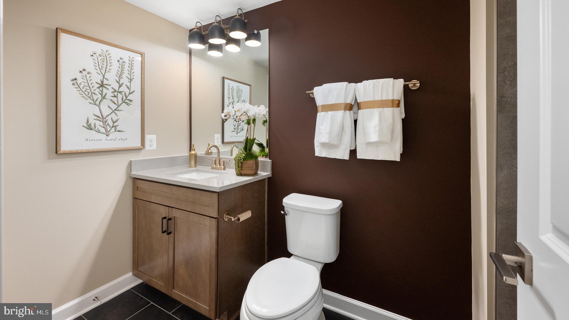 Tbb While Away Drive, Unit RICHMOND Bowie, MD 20716 - Photo 83 of 99 a bathroom with a toilet sink and mirror