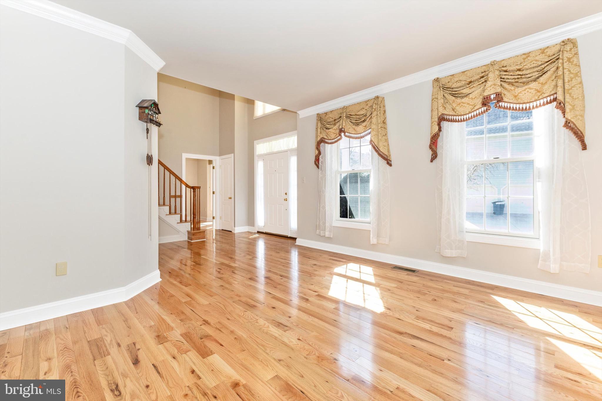 10213 Deep Skies Drive Laurel, MD 20723 - Photo 13 of 56 a view of empty room with wooden floor and fan